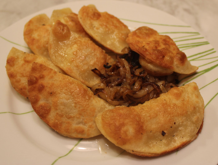 Potato and Cheddar Pierogies with Caramelized Onion from Pierogi Love by Casey Barber