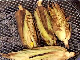 grilled corn with husks on