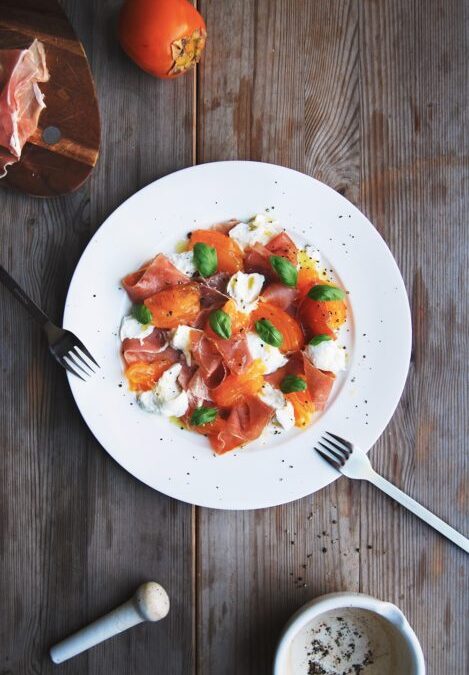 Persimmons, Mozzarella, Prosciutto di Parma, and Basil with Maple Vinaigrette from Eat In My Kitchen by Meike Peters